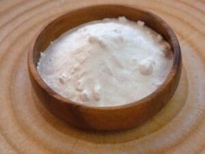 Baking soda. Sodium bicarbonate in a wooden round cup